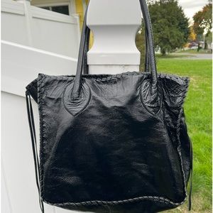 Shelly Litvak pebbled leather soft black tote. Condition is Pre-owned like new.